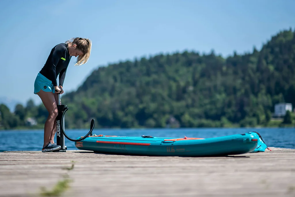 Pumping up an inflatable with a manual pump.